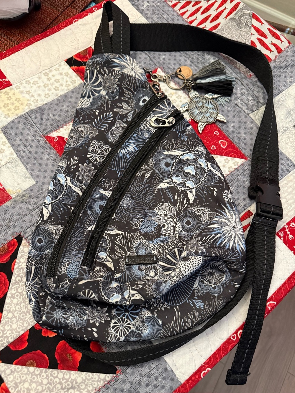 Sakroots Black Crossbody Sling with Blue and White Floral Print